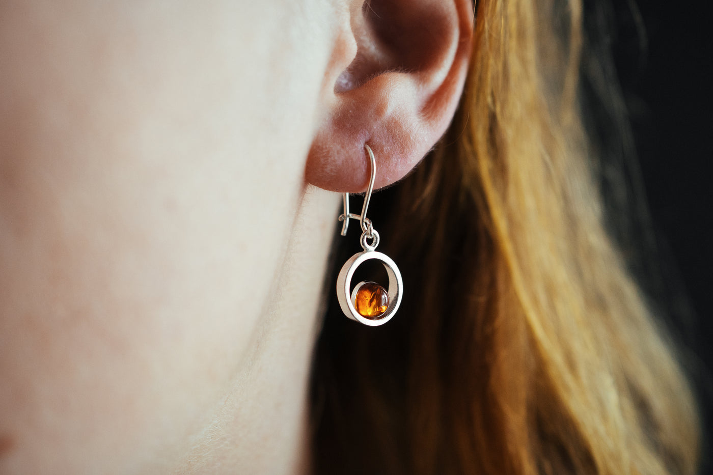 Circular Radiance - Silver Circle Dangle Earrings with Captivating Baltic Amber