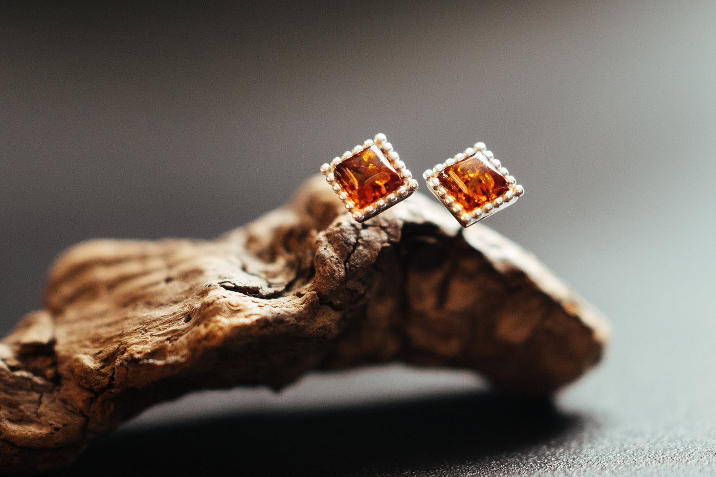 Radiant Reflections - Silver Diamond Shaped Earrings with Baltic Amber