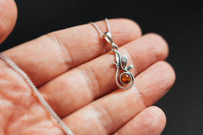 Nurturing Nature - Silver Pendant with Natural Baltic Amber